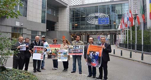 Human Rights activists rally in front of the EU Parliament to denounce the MKO