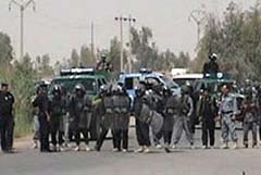 Thirty-five Iranian dissidents arrested by Iraqi security forces during a takeover of their base