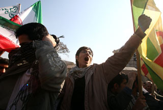 Iranians shout slogans in front of the British Embassy in Tehran.