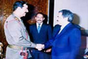 Former Iraqi dictator Saddam (l) and MKO leader Rajavi